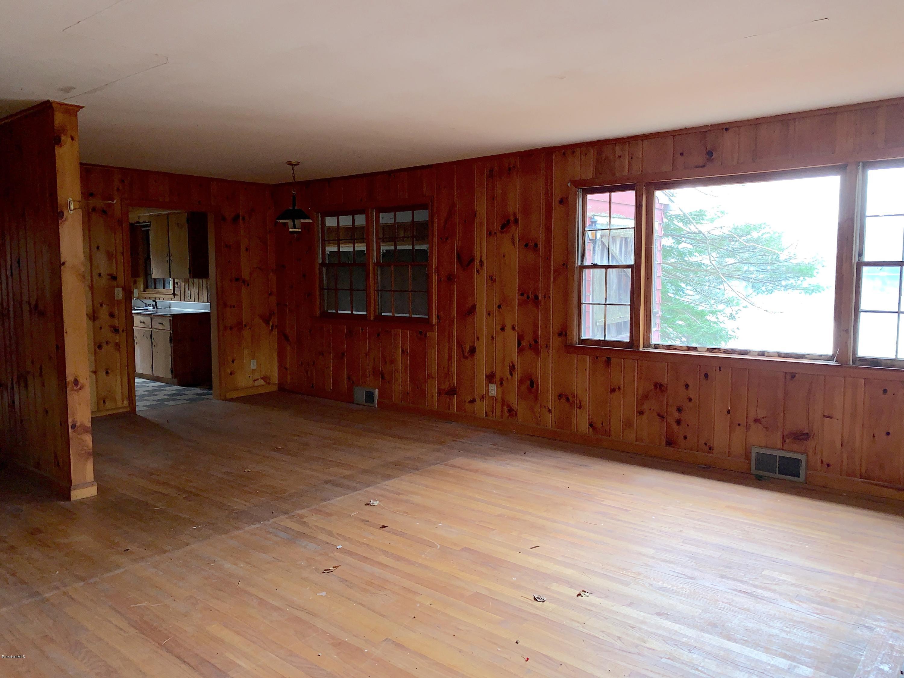 21 Point Road Monterey, MA 01245 - Photo 9 of 25 a view of an empty room with a window and wooden floor