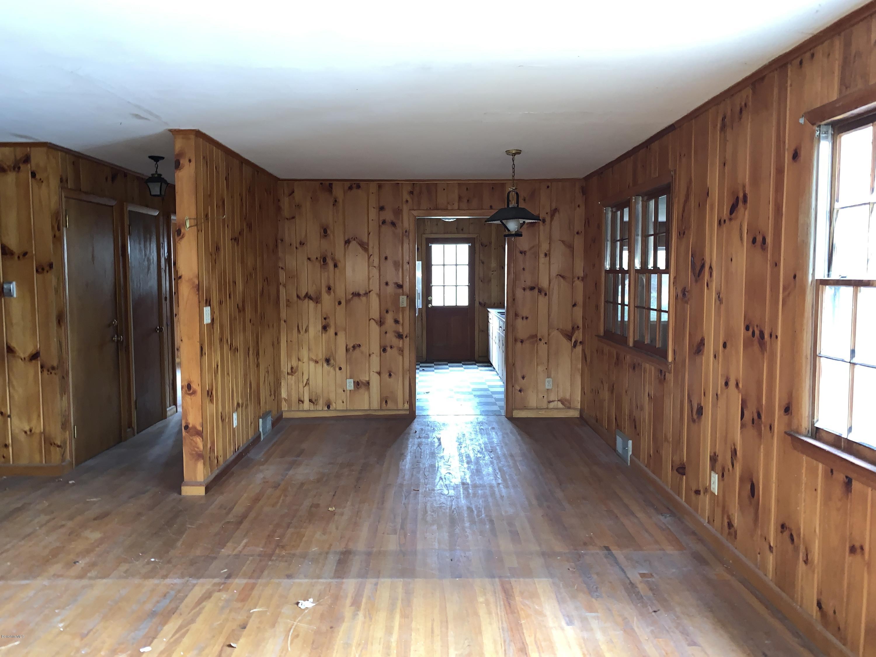 21 Point Road Monterey, MA 01245 - Photo 10 of 25 a view of a hallway with wooden floor and windows