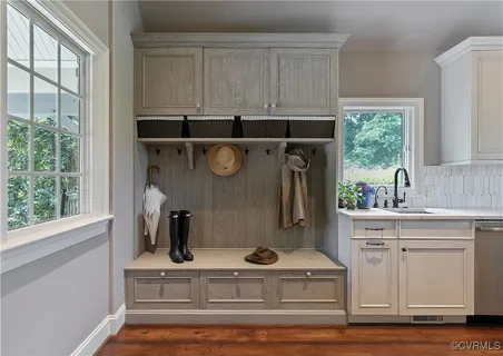 a bedroom with a bed and painting on the wall