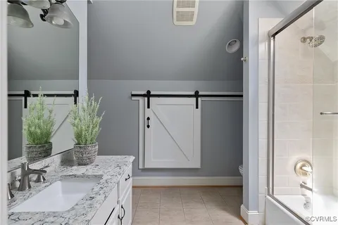 a front view of a house with yard and outdoor seating