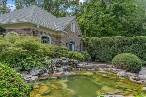 a kitchen with stainless steel appliances granite countertop a stove and cabinets