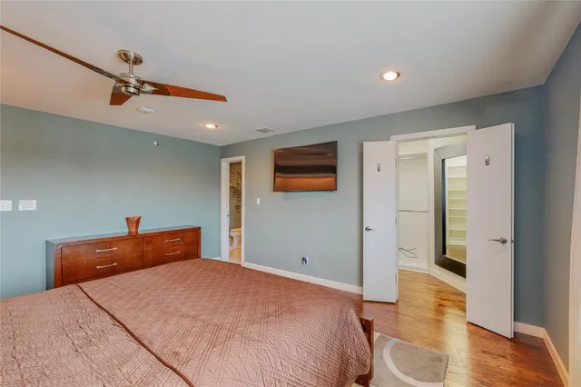 a bedroom with a bed and a view of bathroom