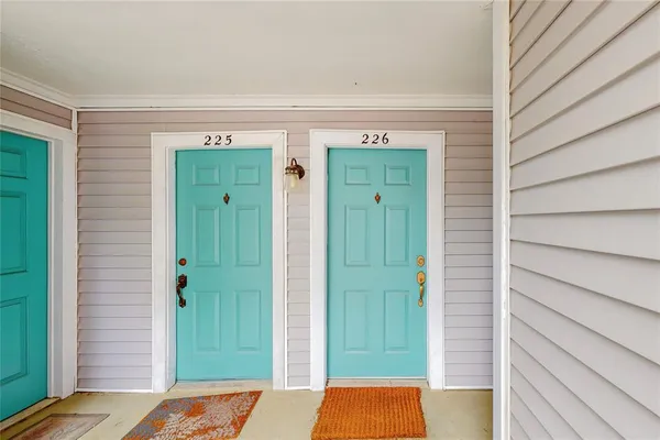 a view of front door with yard
