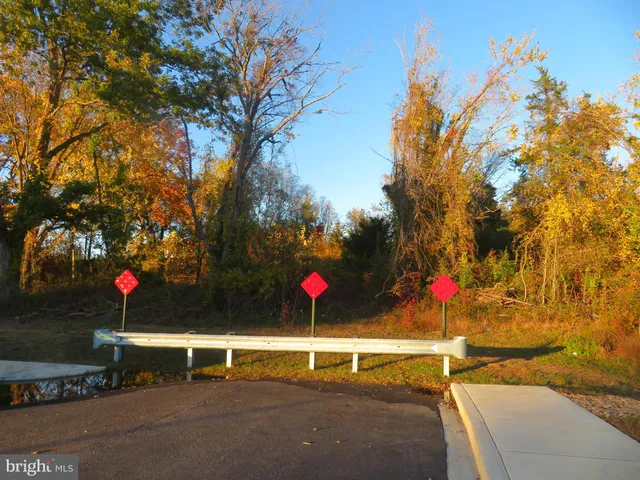 a view of a street with cars on road