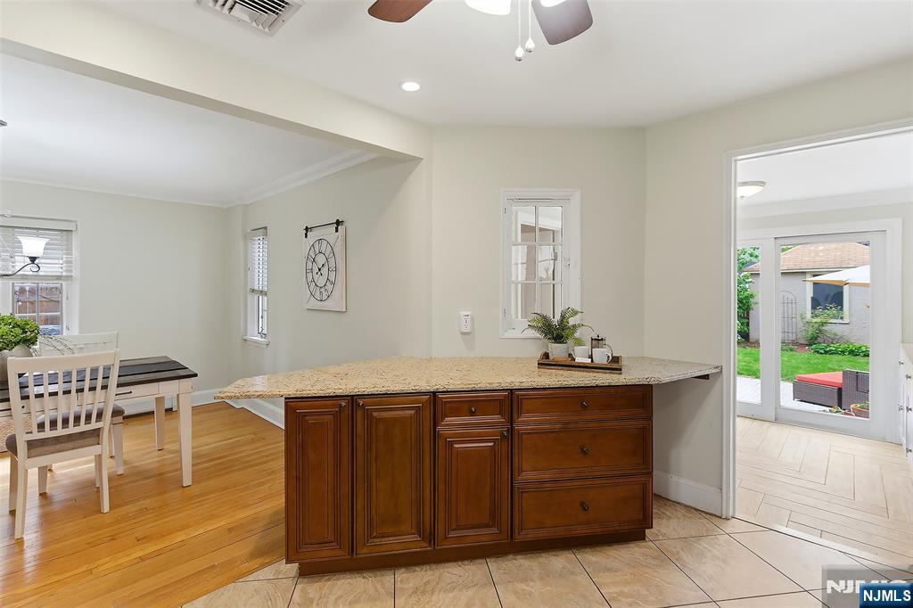 31 Martin Terrace Hackensack, NJ 07601 - Photo 12 of 32 a spacious bathroom with a granite countertop sink and a mirror