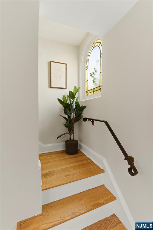 31 Martin Terrace Hackensack, NJ 07601 - Photo 16 of 32 a view of a hallway with wooden floor and a potted plant