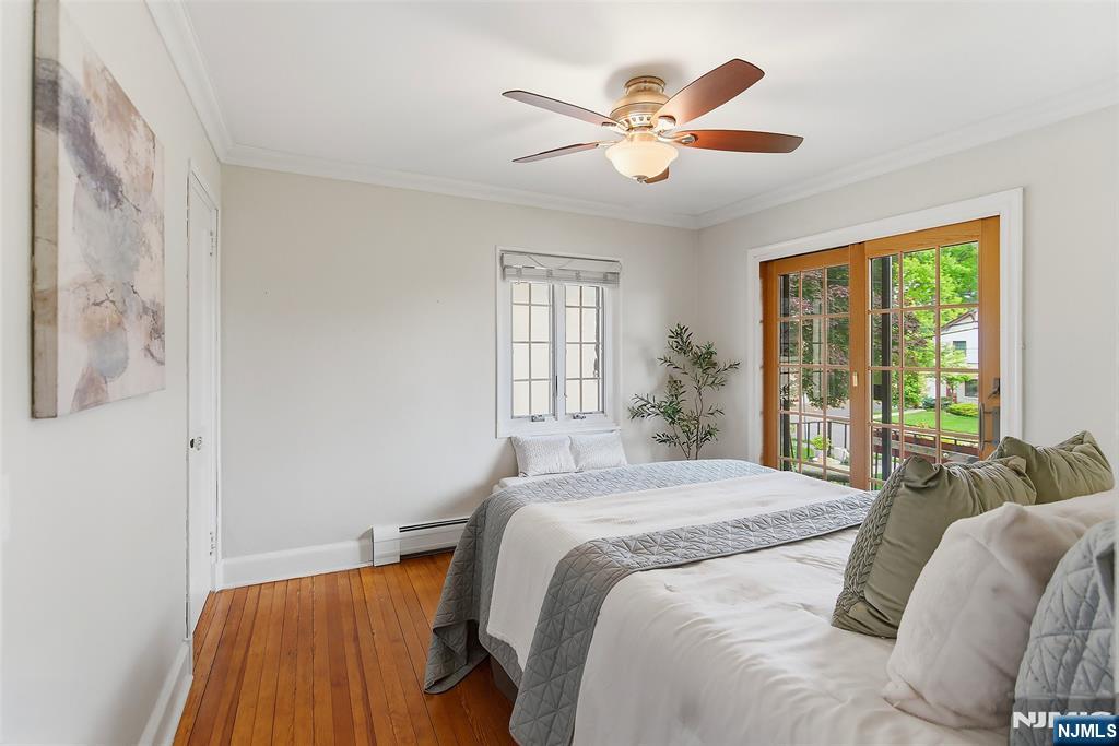31 Martin Terrace Hackensack, NJ 07601 - Photo 18 of 32 a bedroom with a bed and a large window