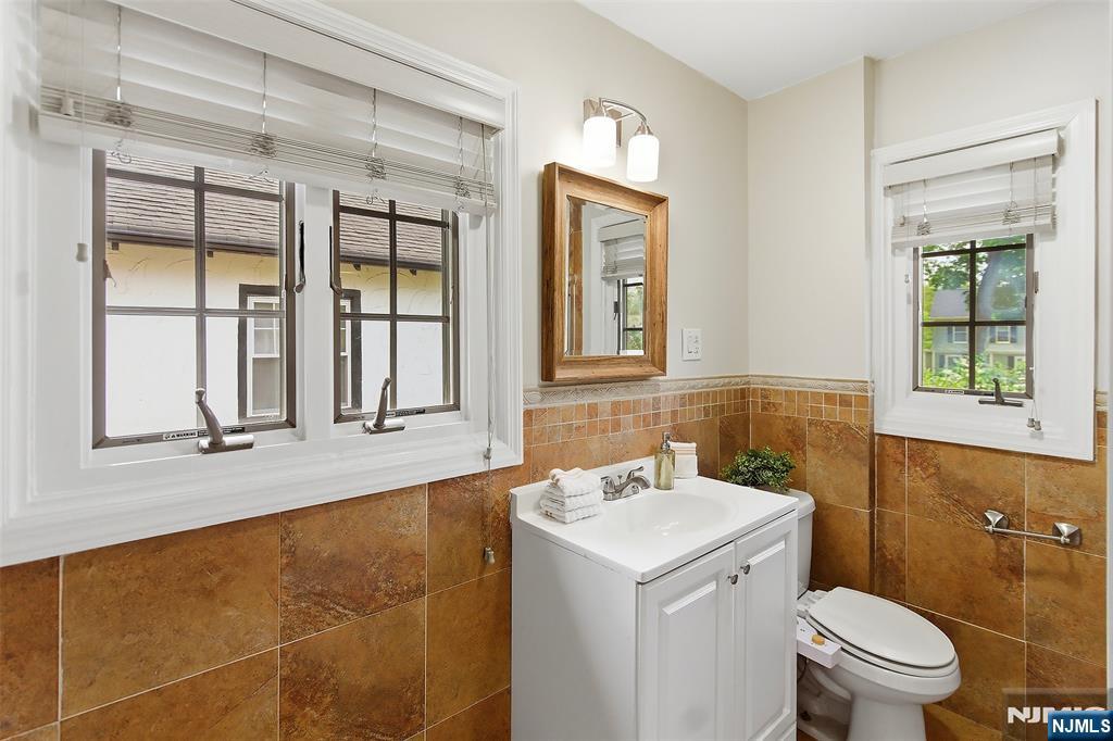 31 Martin Terrace Hackensack, NJ 07601 - Photo 23 of 32 a bathroom with a sink and a toilet