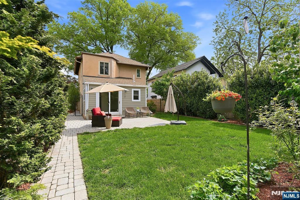 31 Martin Terrace Hackensack, NJ 07601 - Photo 30 of 32 a front view of a house with swing and table and chairs