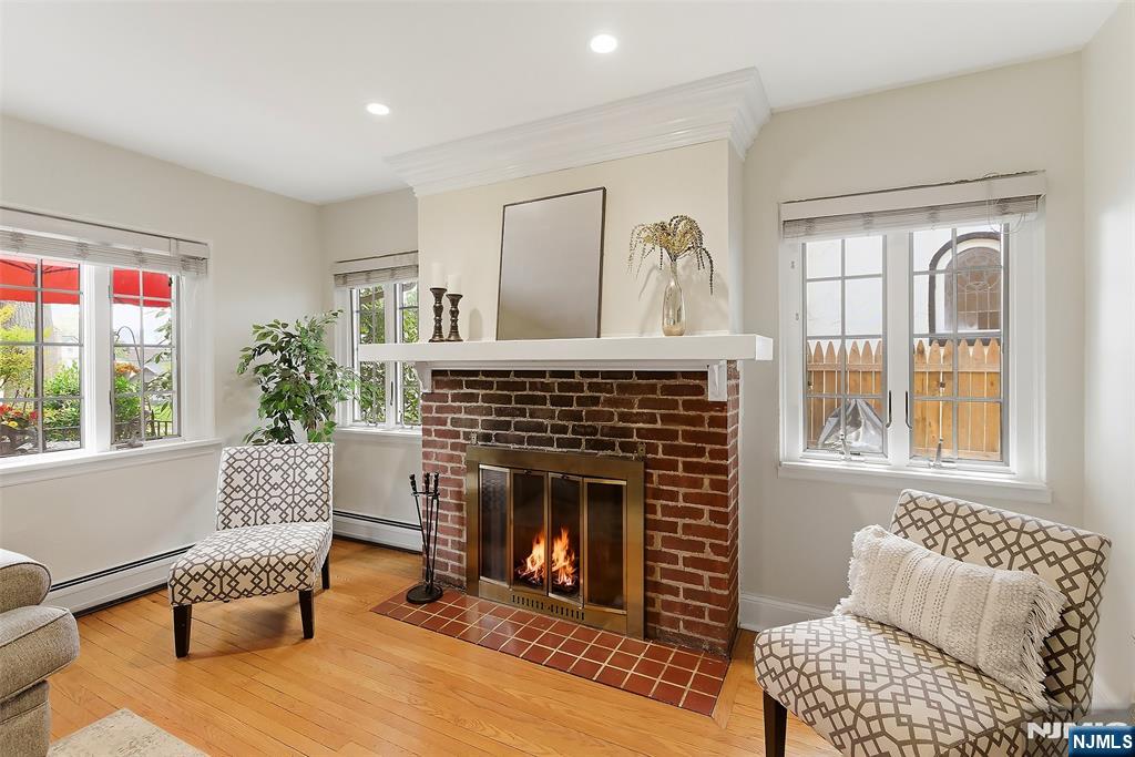 31 Martin Terrace Hackensack, NJ 07601 - Photo 6 of 32 a living room with furniture and a fireplace