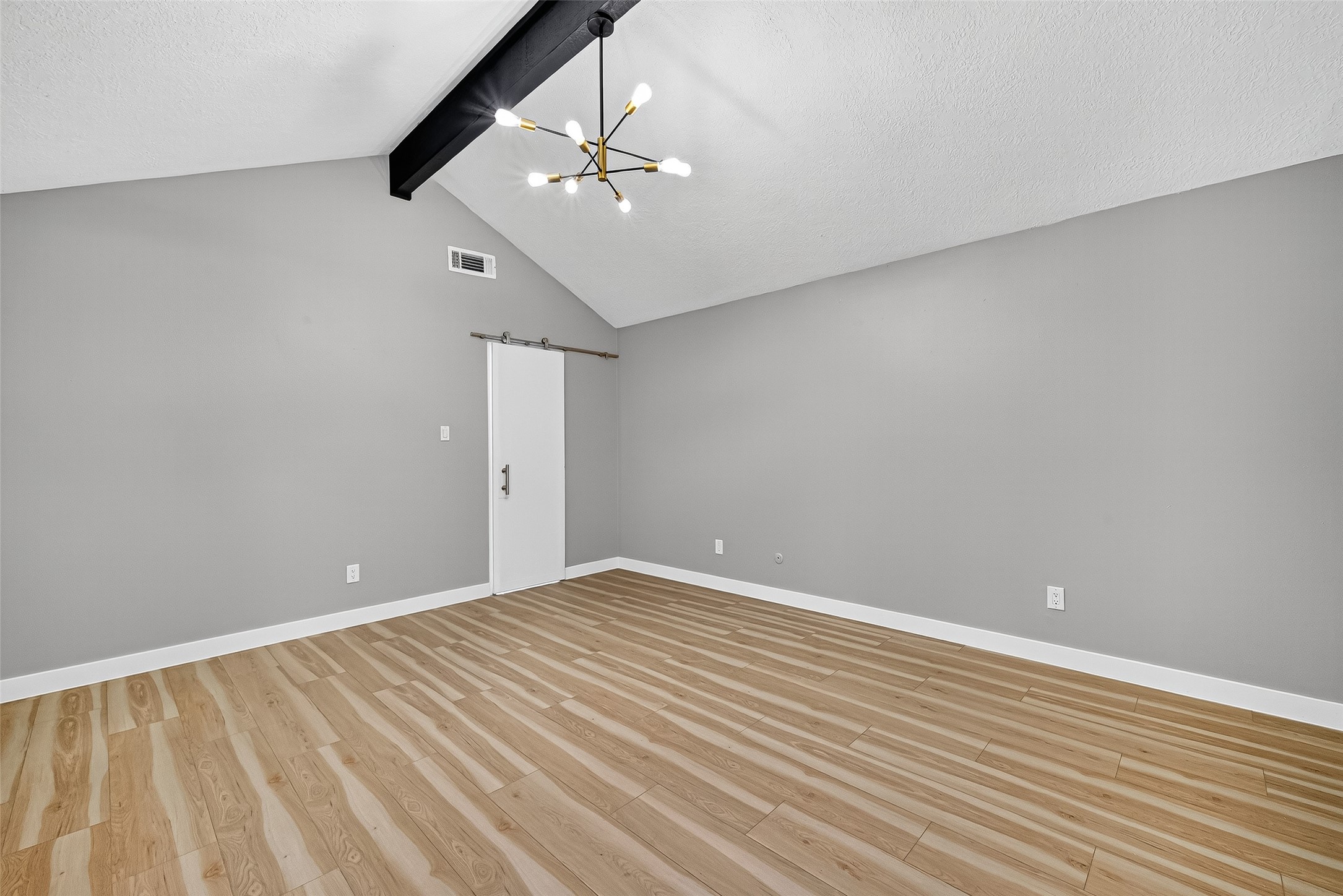 2026 Ashford Hollow Lane Houston, TX 77077 - Photo 13 of 35 a view of an empty room with wooden floor
