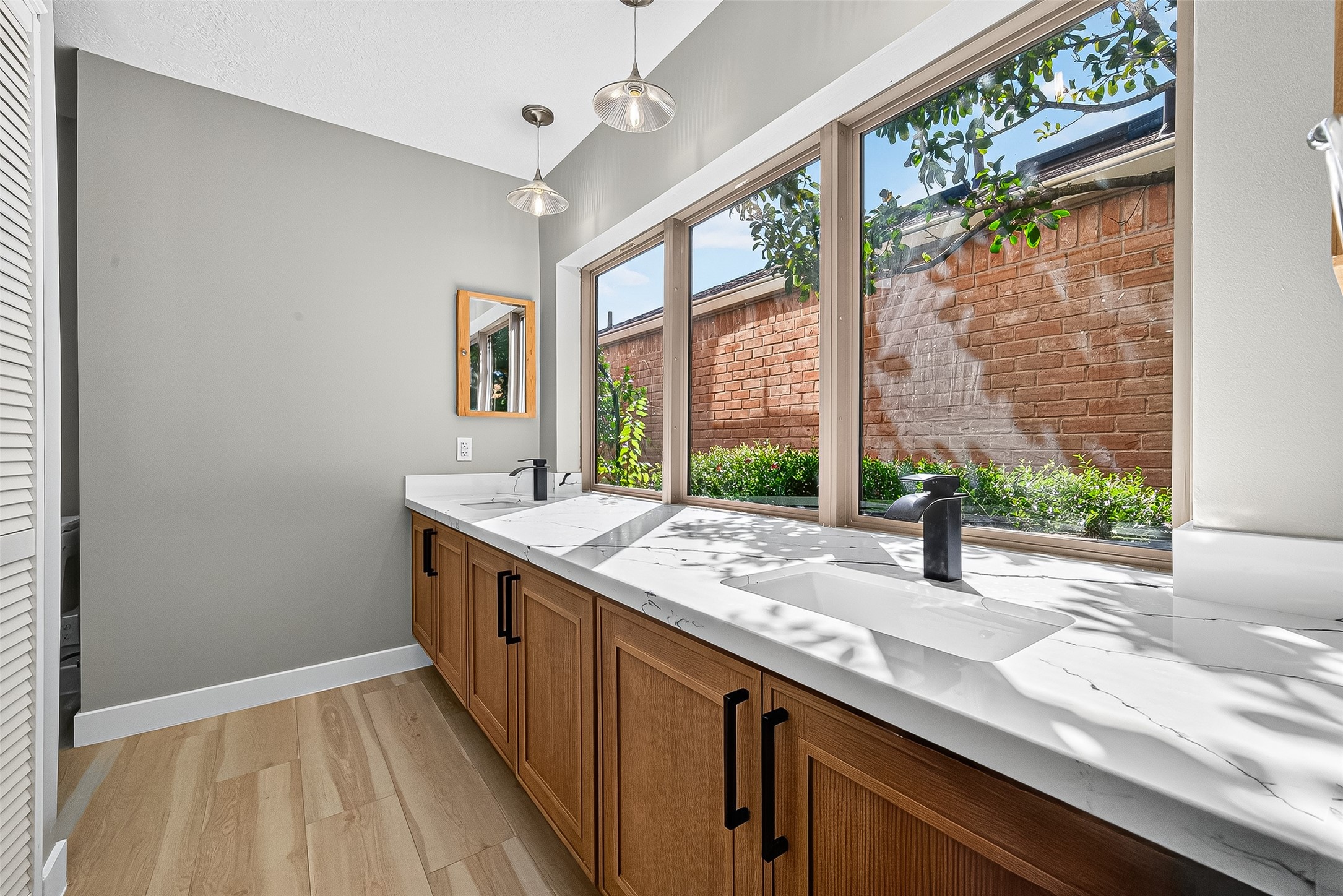2026 Ashford Hollow Lane Houston, TX 77077 - Photo 14 of 35 a kitchen with a sink and a large window