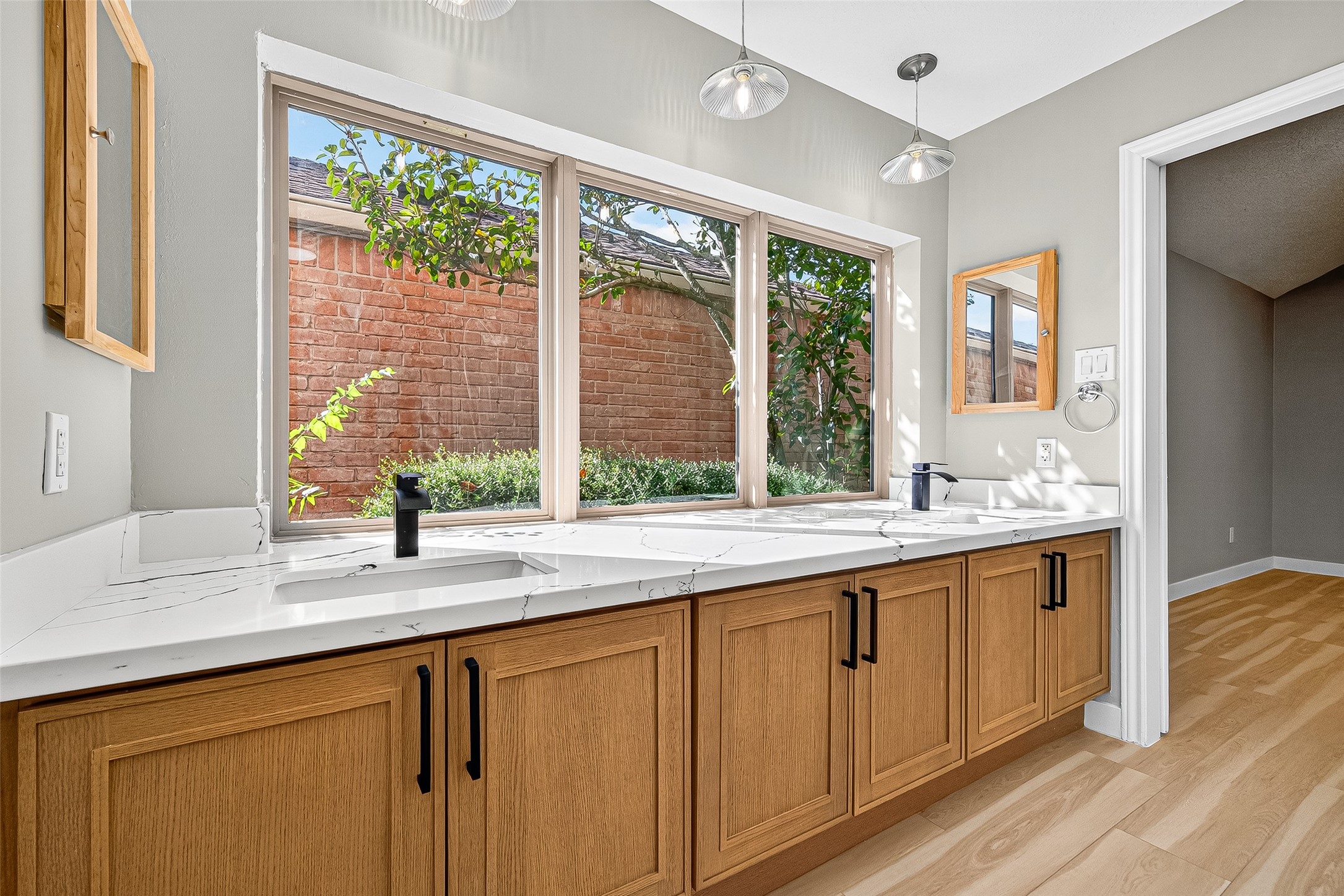 2026 Ashford Hollow Lane Houston, TX 77077 - Photo 15 of 35 a kitchen with a sink and large window