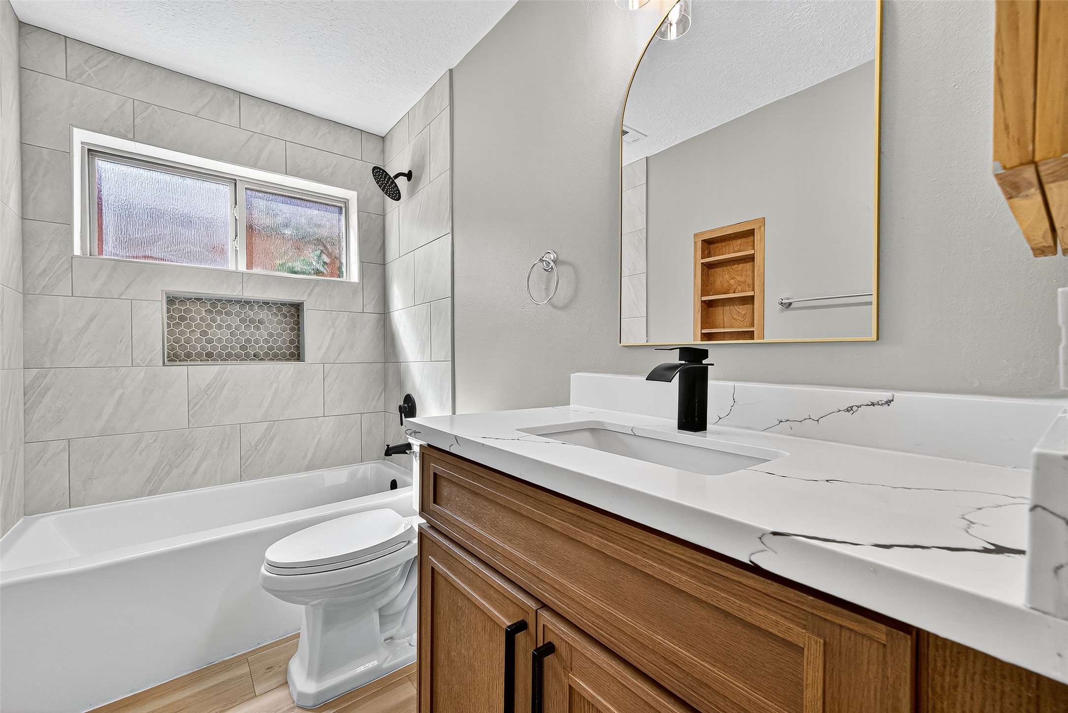 2026 Ashford Hollow Lane Houston, TX 77077 - Photo 21 of 35 a bathroom with a sink a toilet and shower