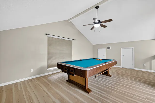 a view of a porch with furniture and floor to ceiling window