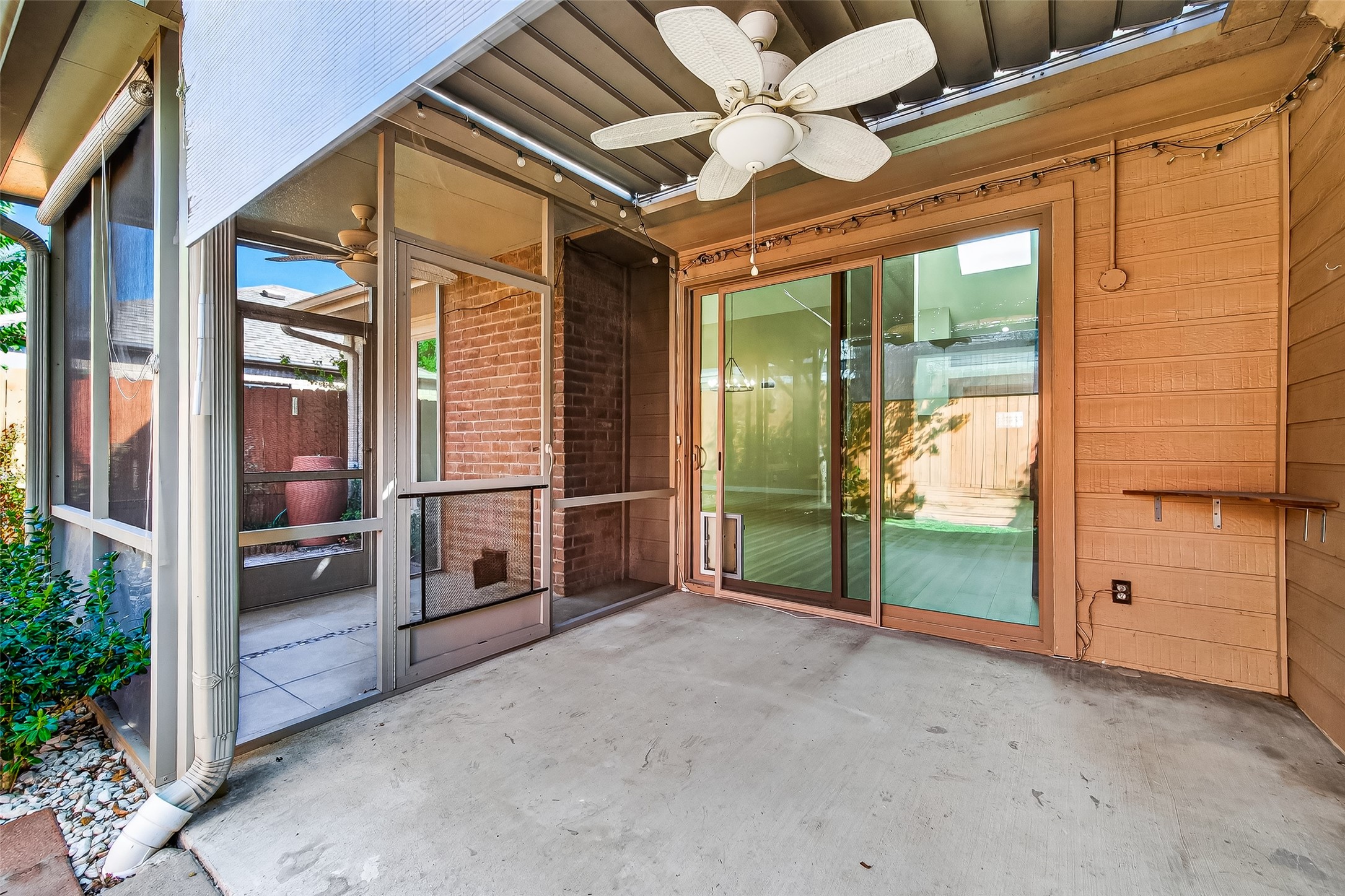 2026 Ashford Hollow Lane Houston, TX 77077 - Photo 27 of 35 a view of a porch with furniture and floor to ceiling window