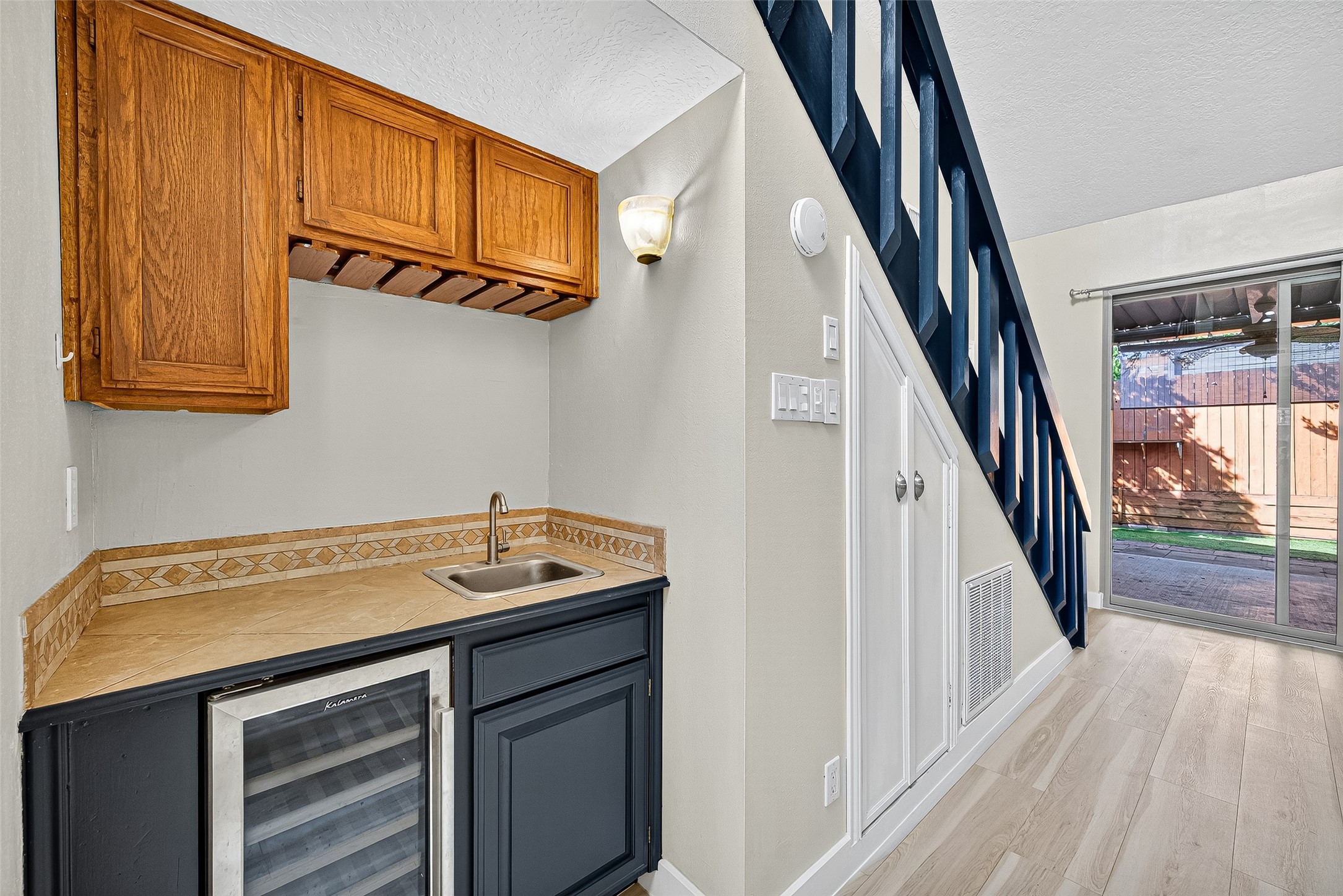 2026 Ashford Hollow Lane Houston, TX 77077 - Photo 3 of 35 a utility room with a sink a washer and dryer