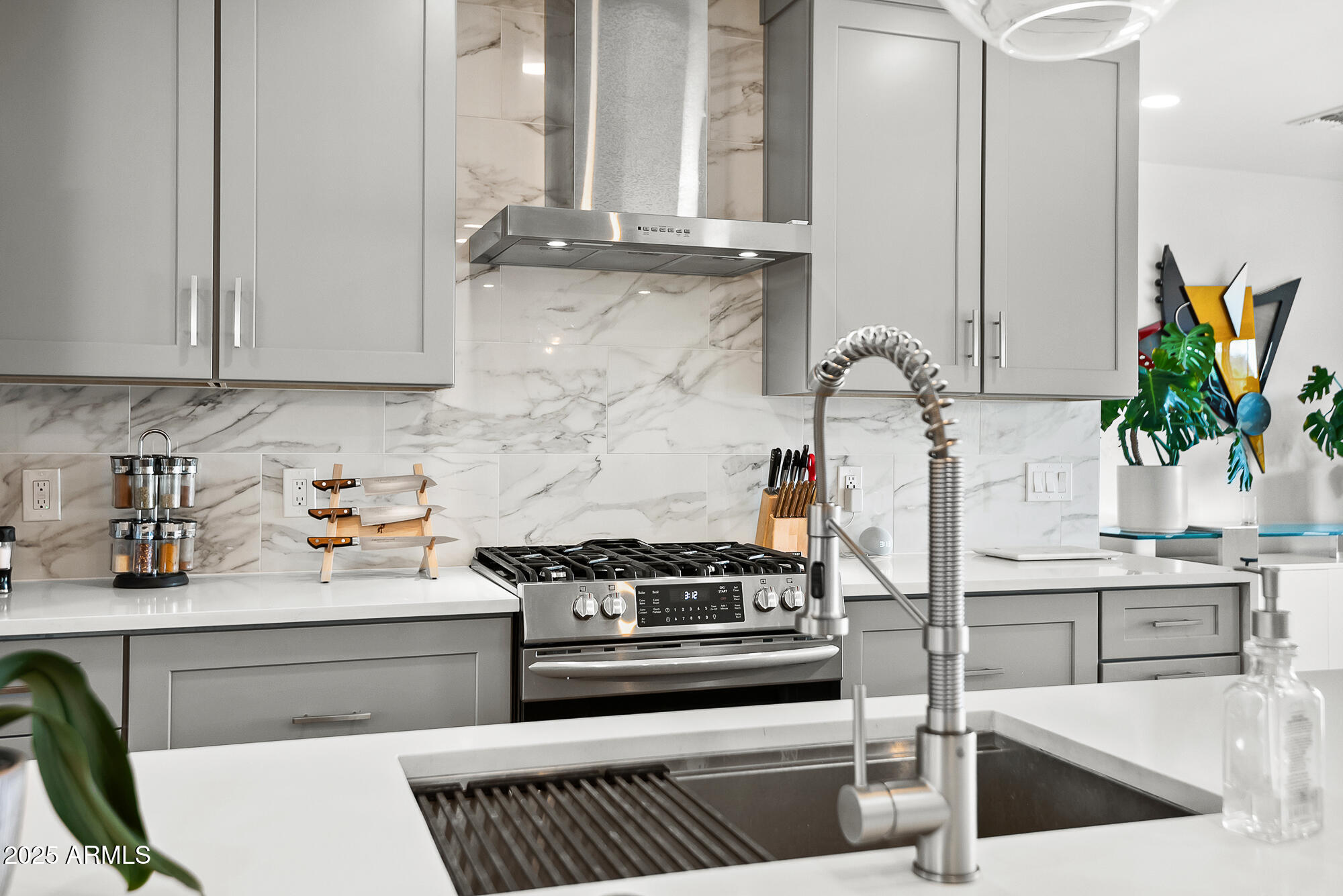 4526 East Heatherbrae Drive Phoenix, AZ 85018 - Photo 11 of 34 a kitchen with stainless steel appliances granite countertop a stove and a cabinets