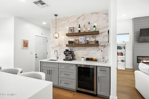a view of kitchen with cabinets and wooden floor