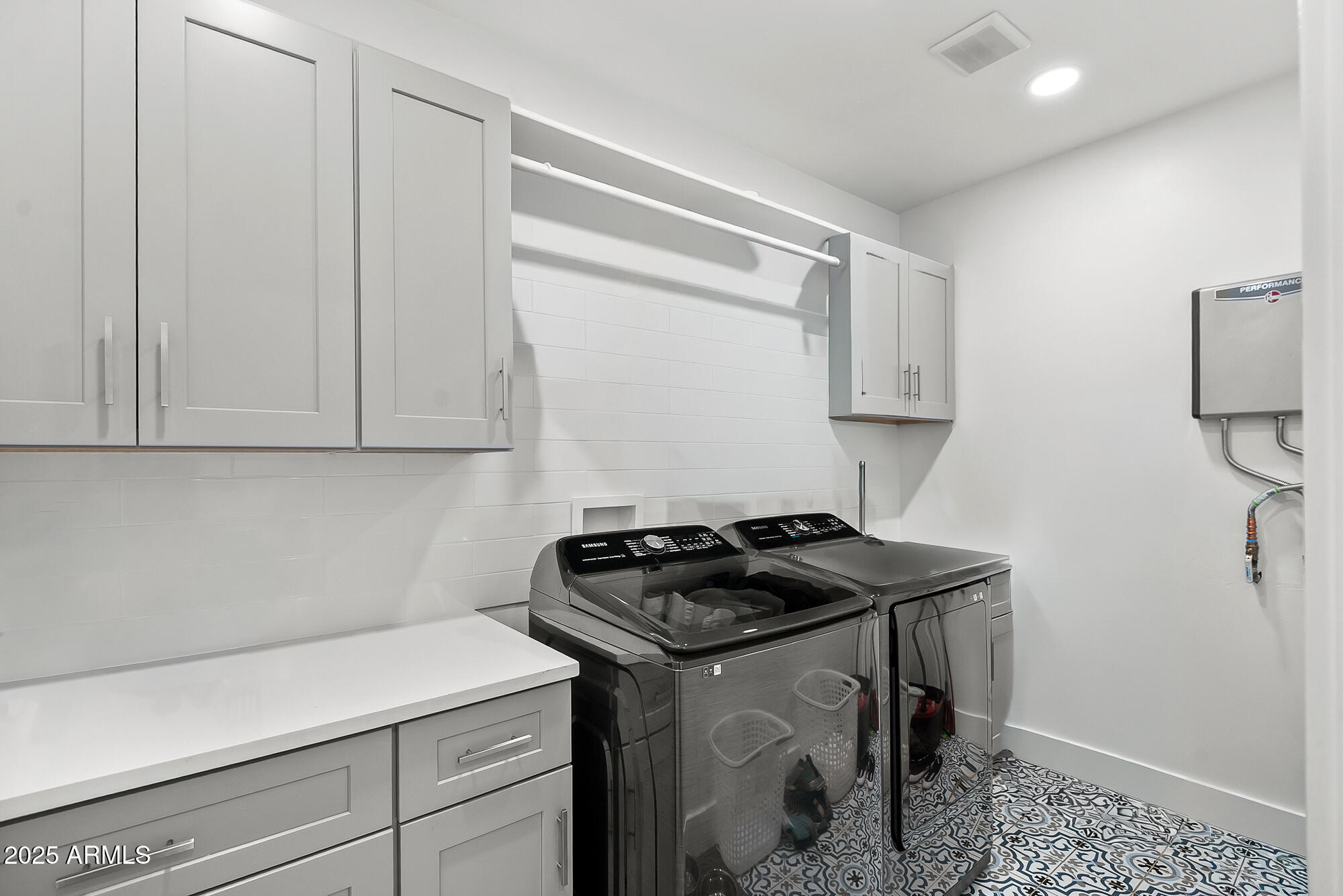 4526 East Heatherbrae Drive Phoenix, AZ 85018 - Photo 19 of 34 a kitchen with a sink and cabinets