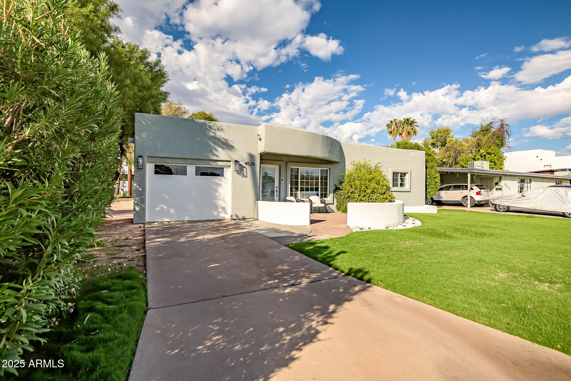 4526 East Heatherbrae Drive Phoenix, AZ 85018 - Photo 2 of 34 a view of a street with houses
