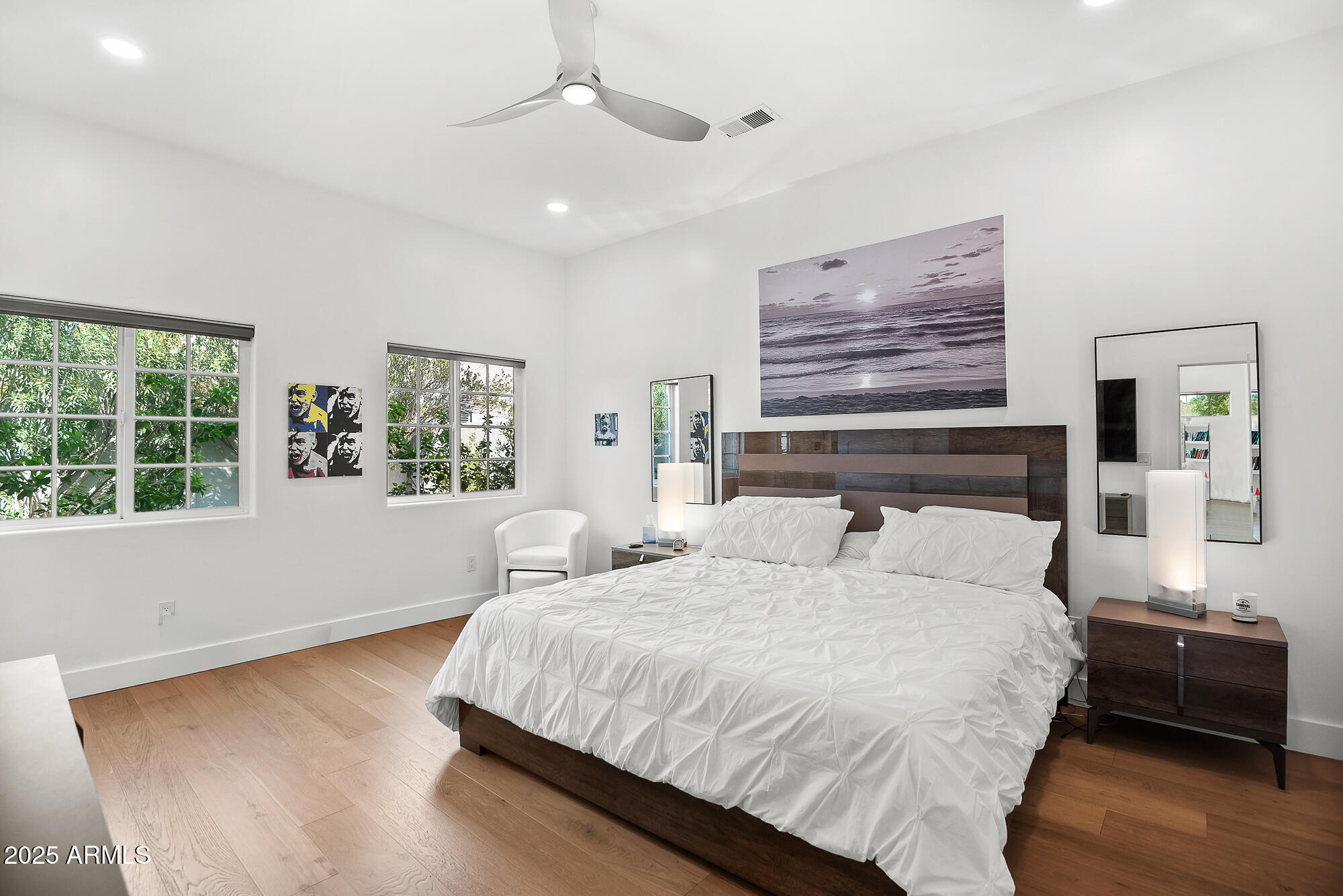 4526 East Heatherbrae Drive Phoenix, AZ 85018 - Photo 21 of 34 a bedroom with a large bed and a window