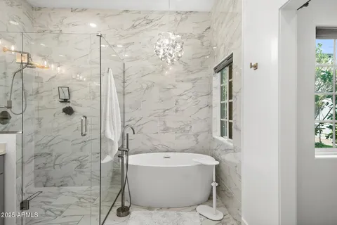 a bathroom with a granite countertop shower a toilet and a shower