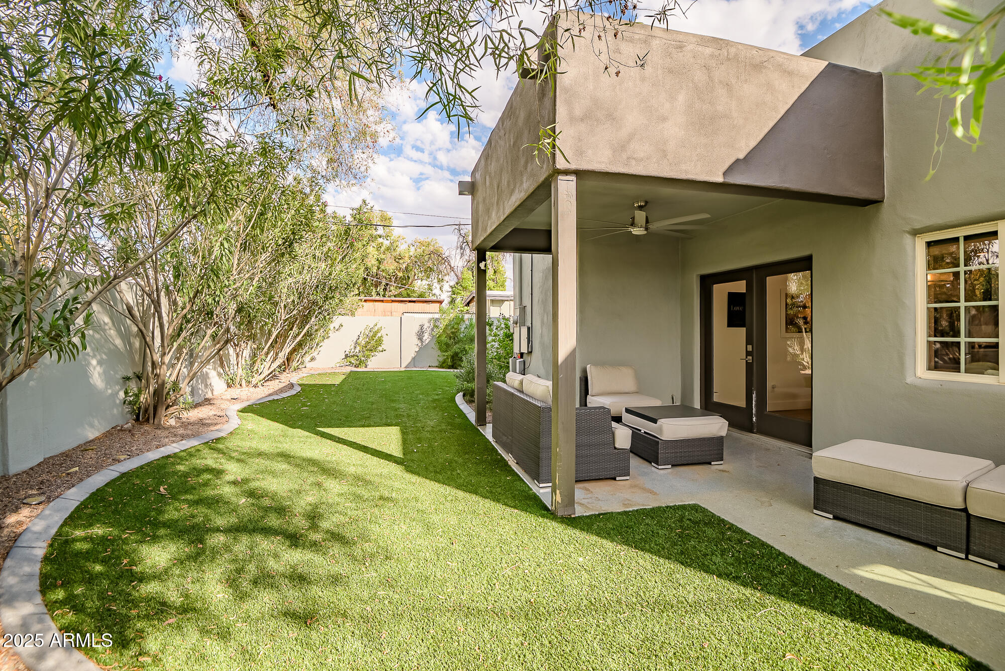 4526 East Heatherbrae Drive Phoenix, AZ 85018 - Photo 31 of 34 a view of a house with backyard and sitting area