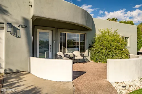 a view of a swimming pool with an outdoor seating
