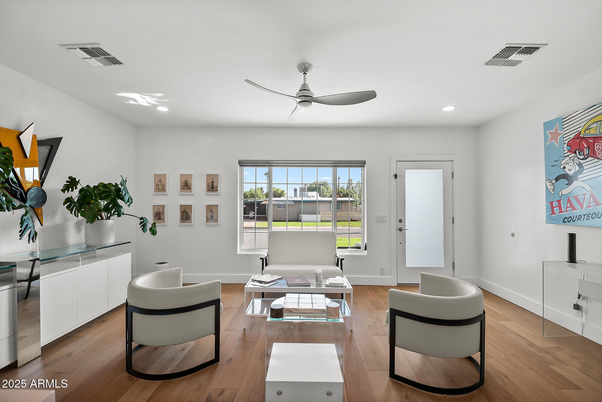 4526 East Heatherbrae Drive Phoenix, AZ 85018 - Photo 6 of 34 a living room with furniture and a large window
