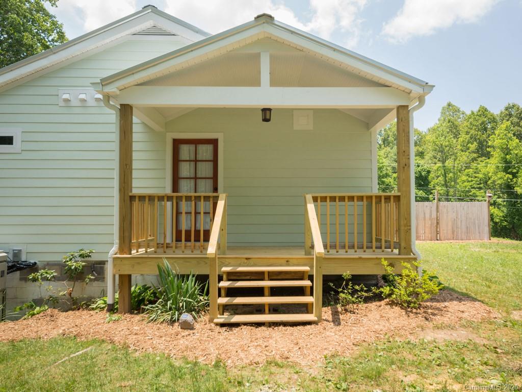249 Bane Road Mills River, NC 28759 - Photo 14 of 30 a front view of a house with a yard