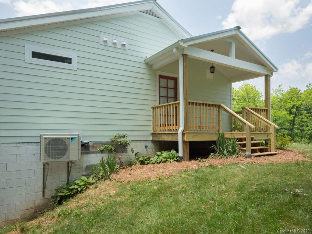 249 Bane Road Mills River, NC 28759 - Photo 15 of 30 a front view of a house with a yard