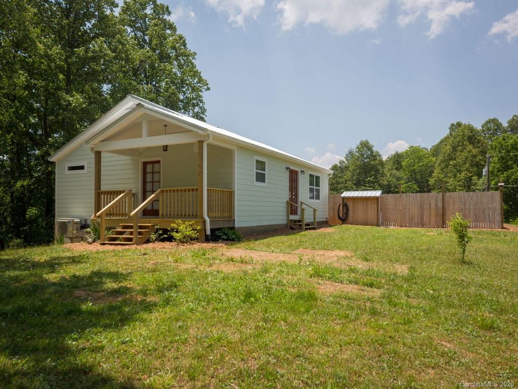 249 Bane Road Mills River, NC 28759 - Photo 16 of 30 a view of a house with backyard and trees