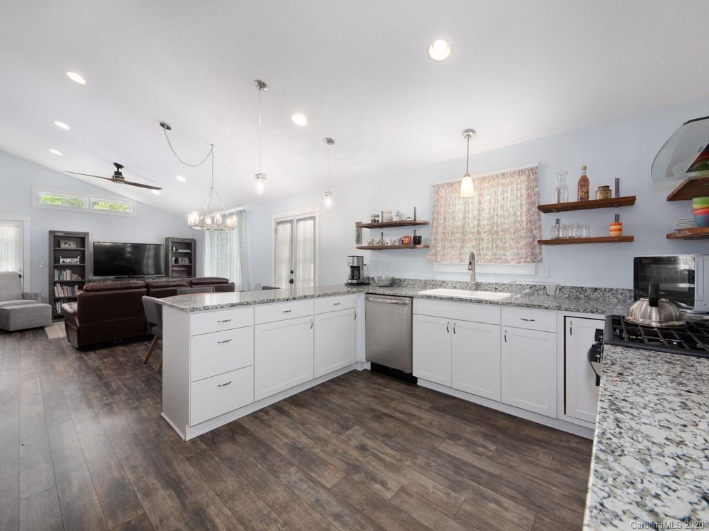 249 Bane Road Mills River, NC 28759 - Photo 23 of 30 a kitchen with a sink cabinets and wooden floor