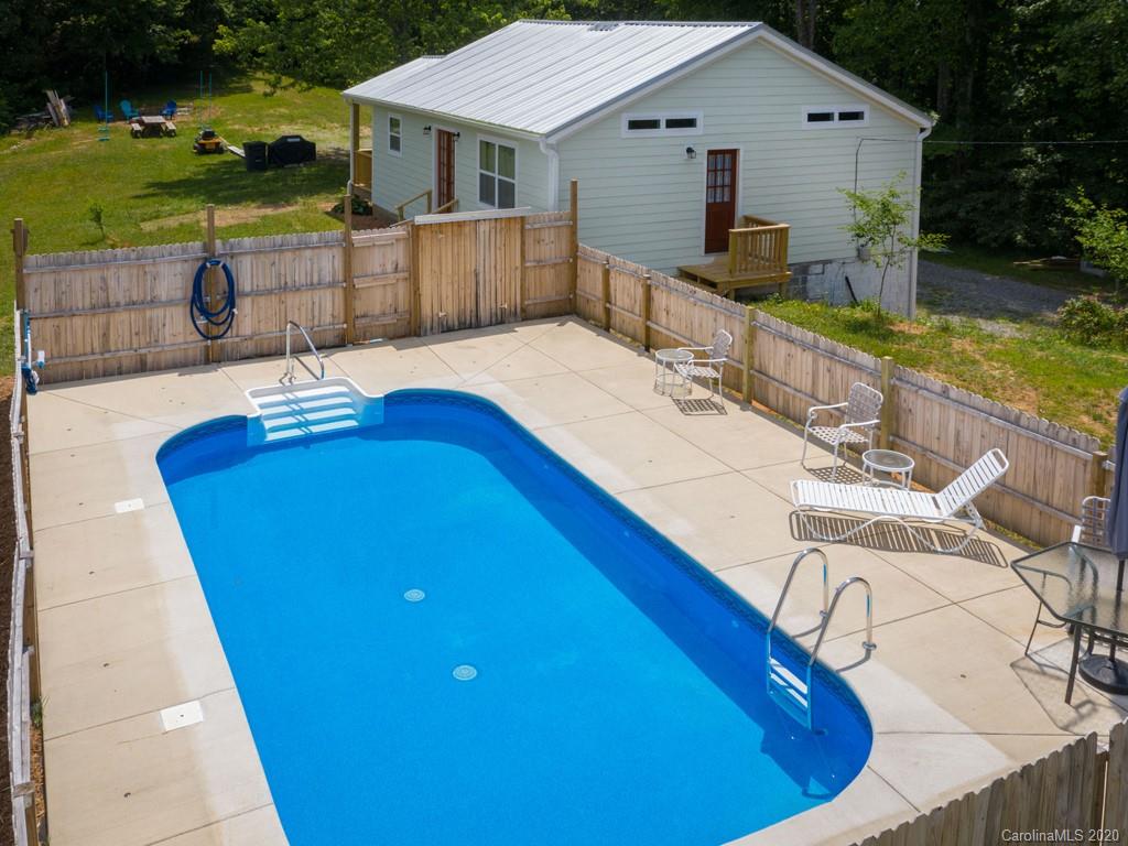 249 Bane Road Mills River, NC 28759 - Photo 4 of 30 a view of a house with pool and chairs