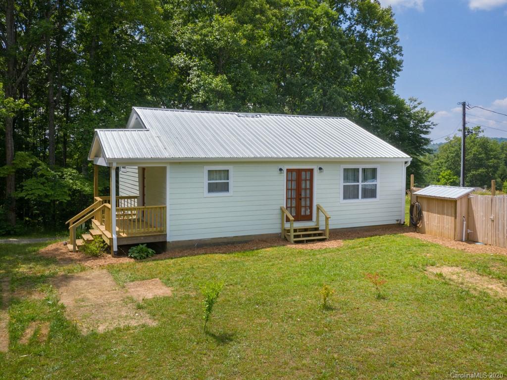 249 Bane Road Mills River, NC 28759 - Photo 7 of 30 a house that has a tree in front of it