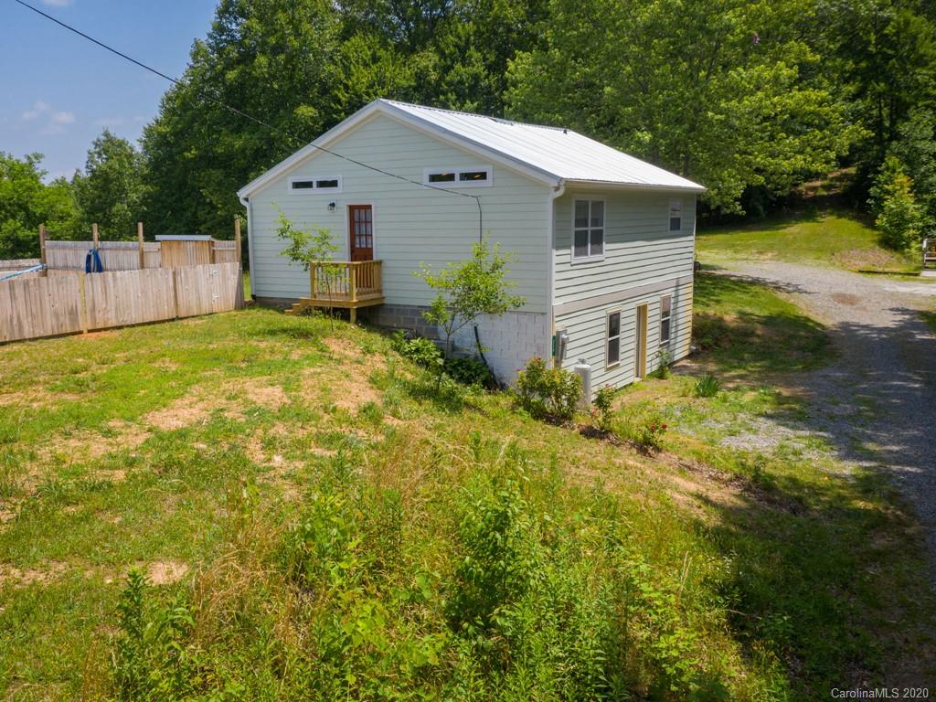 249 Bane Road Mills River, NC 28759 - Photo 9 of 30 a front view of house with yard and trees in the background