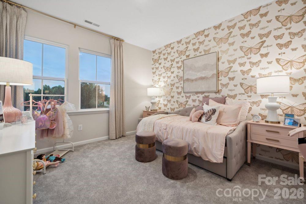 8671 Miles Gap Road Indian Land, SC 29707 - Photo 18 of 31 a bed room with a bed and a chair