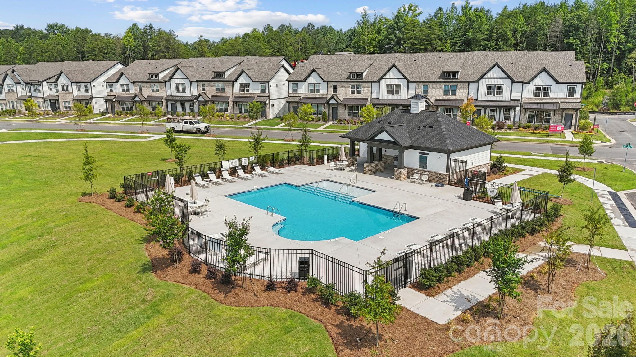 8671 Miles Gap Road Indian Land, SC 29707 - Photo 23 of 31 a view of a swimming pool with lawn chairs