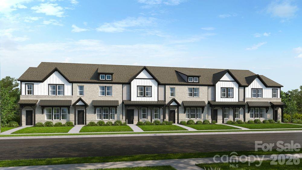 8671 Miles Gap Road Indian Land, SC 29707 - Photo 3 of 31 a front view of a residential apartment building with a yard