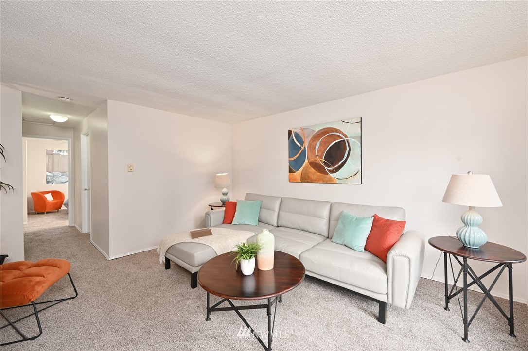9211 3rd Place Southeast Everett, WA 98208 - Photo 17 of 33 a living room with furniture and a table