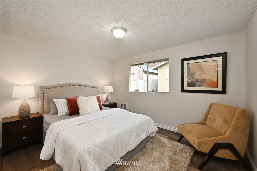 9211 3rd Place Southeast Everett, WA 98208 - Photo 21 of 33 a bedroom with a bed and chair