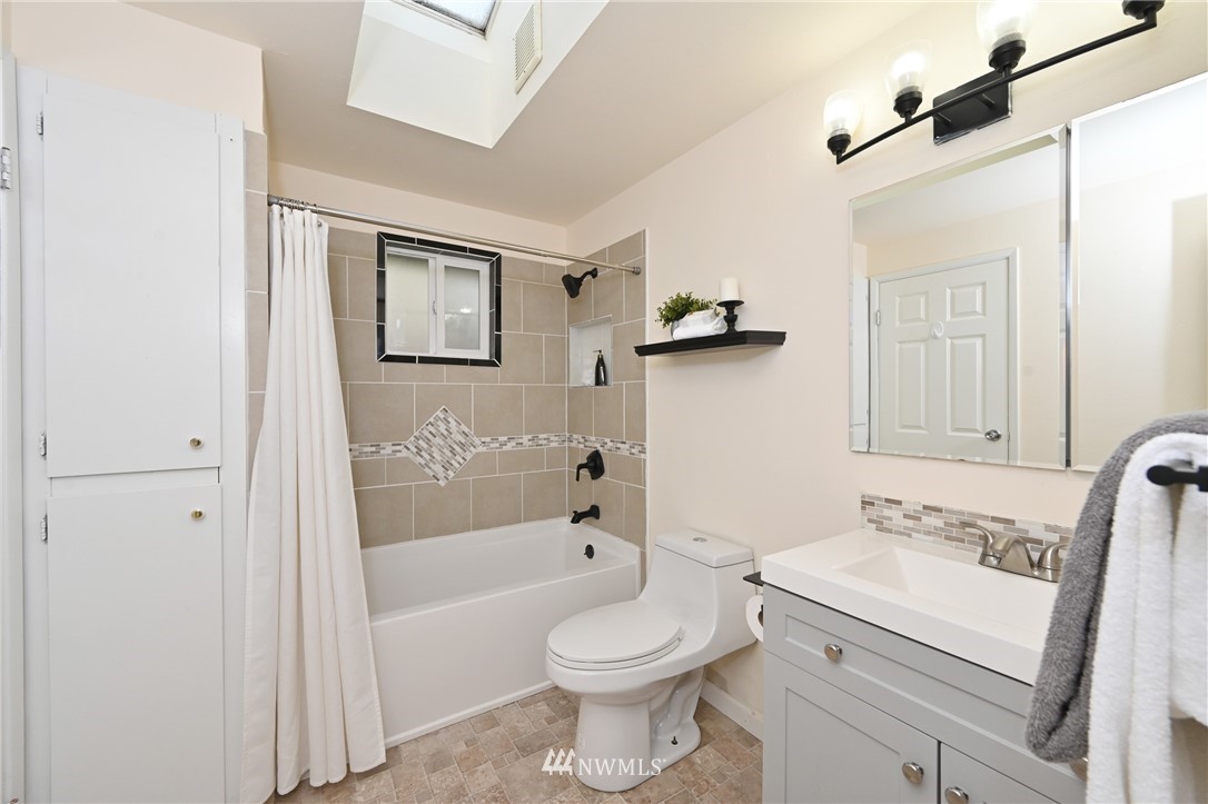 9211 3rd Place Southeast Everett, WA 98208 - Photo 24 of 33 a bathroom with a sink toilet and shower