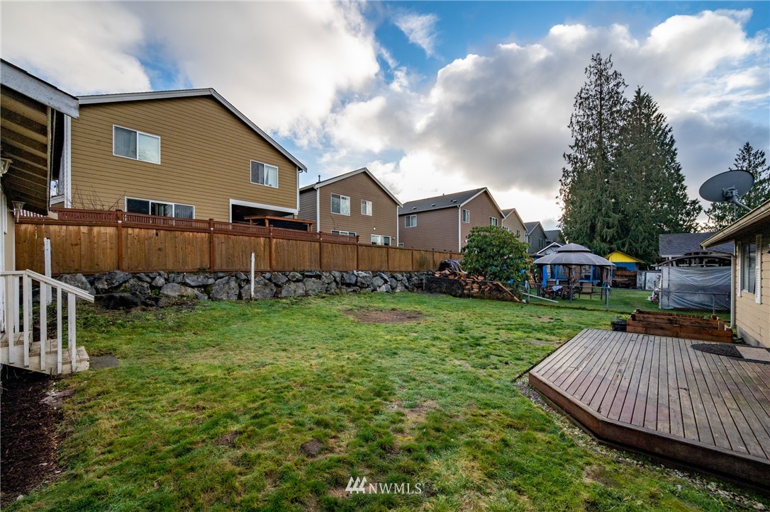 9211 3rd Place Southeast Everett, WA 98208 - Photo 29 of 33 a front view of a house with garden