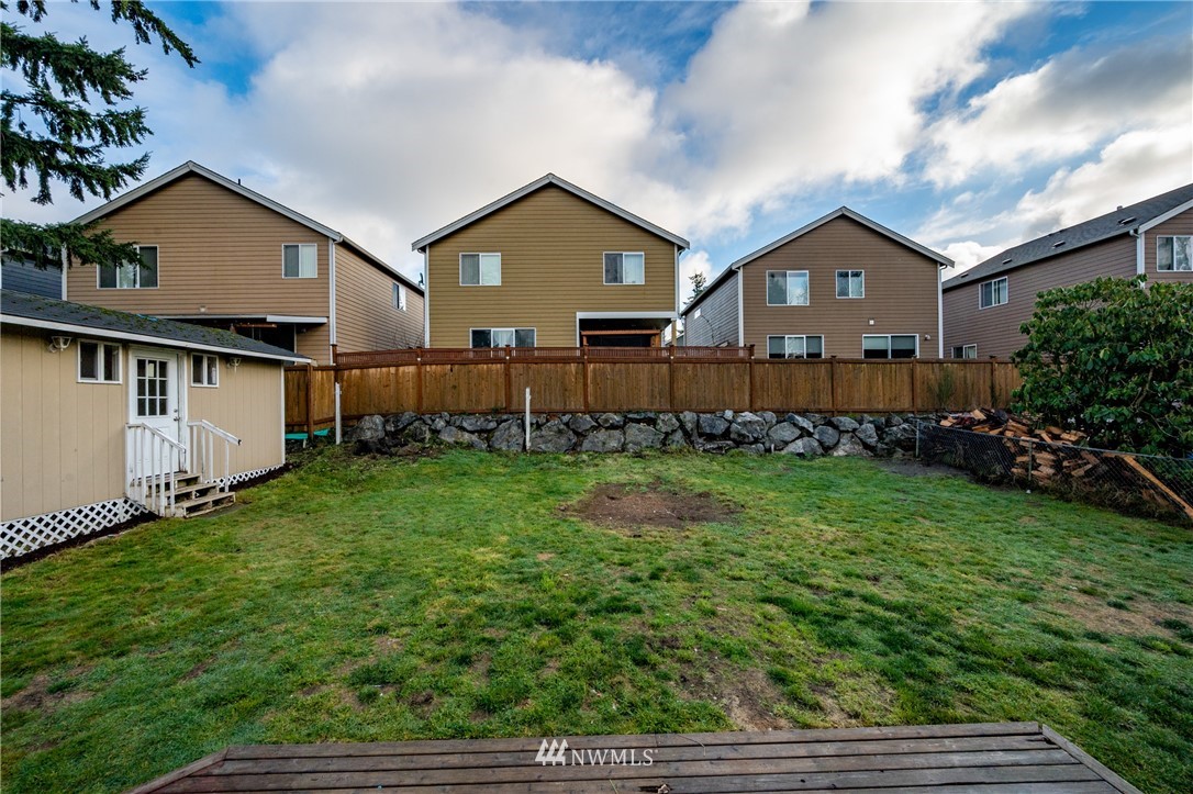 9211 3rd Place Southeast Everett, WA 98208 - Photo 30 of 33 a front view of a house with garden