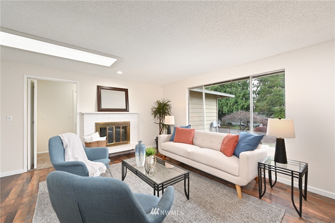 9211 3rd Place Southeast Everett, WA 98208 - Photo 4 of 33 a living room with furniture and a fireplace