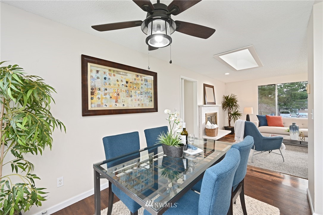 9211 3rd Place Southeast Everett, WA 98208 - Photo 8 of 33 a view of a dining room with furniture window and wooden floor
