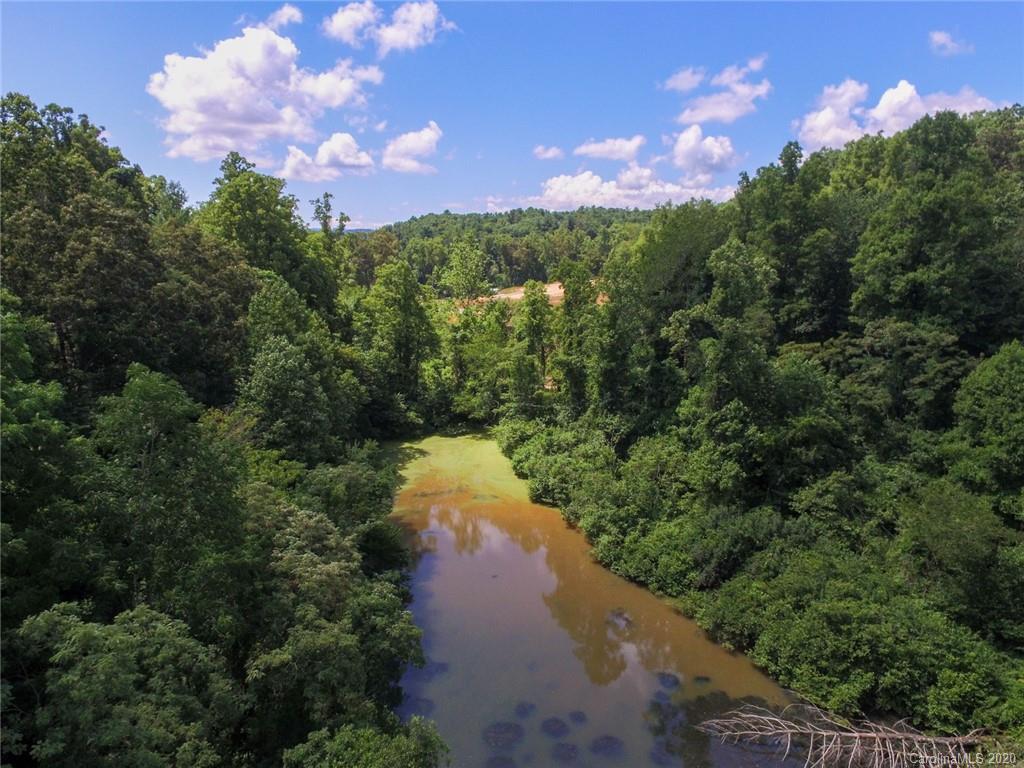 44 Lakeside Drive Asheville, NC 28806 - Photo 11 of 16 a view of a lake with a house in the background