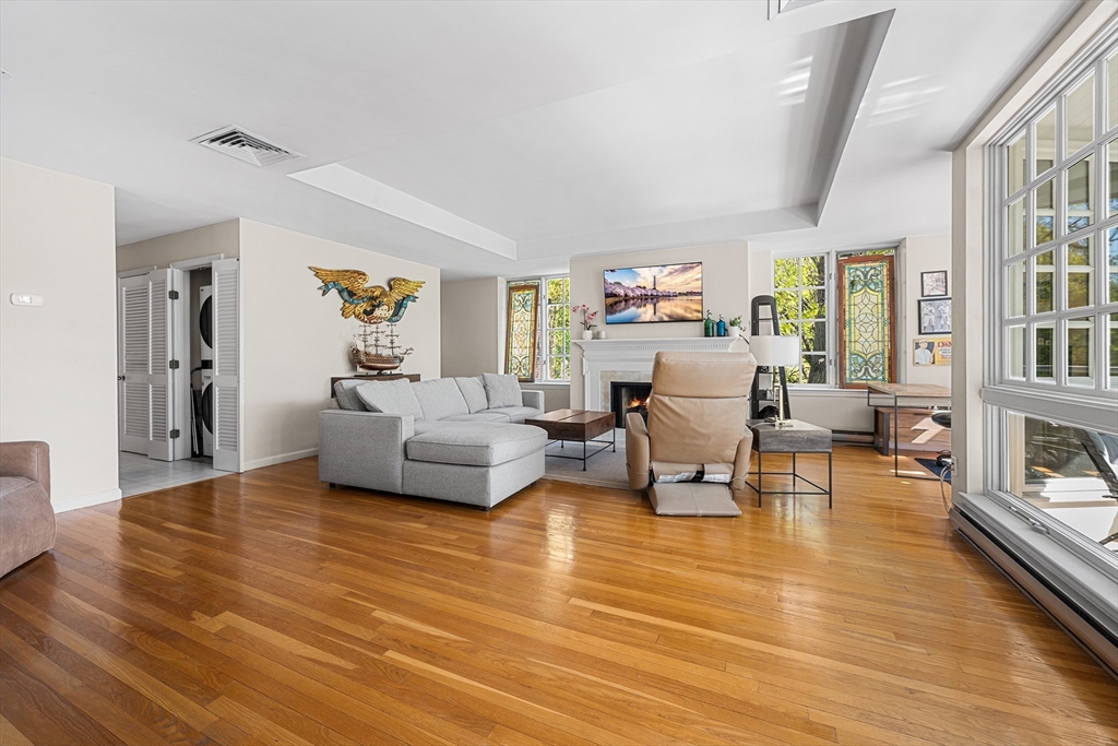 63 Garden Road, Unit C5 Wellesley, MA 02481 - Photo 4 of 30 a living room with furniture and a wooden floor