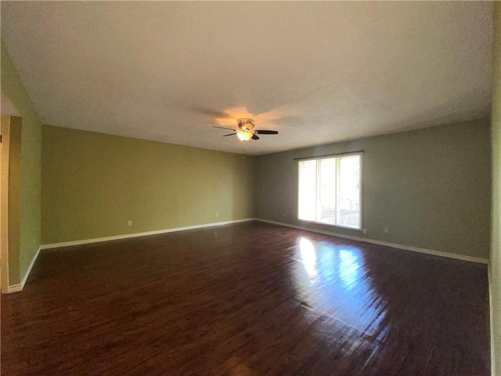 310 Sunset Boulevard Portland, TX 78374 - Photo 6 of 18 a view of wooden floor and windows in a room